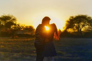 Couple Kiss On Sunrise Wallpaper