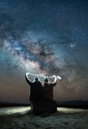 Couple Under Starry Sky Wallpaper