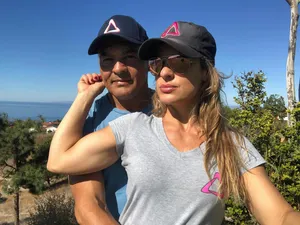 Couplein Matching Hats Outdoors Wallpaper