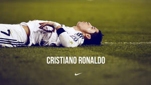 Cr7 Hd Lying On Grass Wallpaper