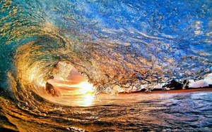 Crashing Wave And Golden Sun Wallpaper