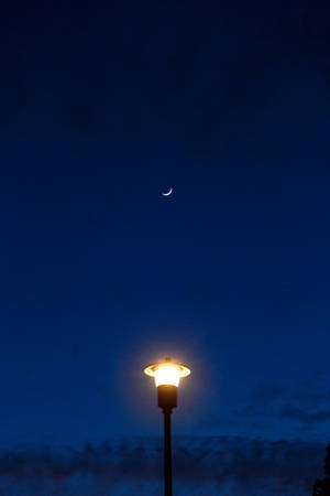 Crescent Moon In Blue Sky Wallpaper