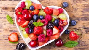 Crisp Berries In Heart Bowl Wallpaper