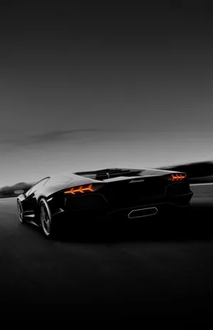Cruise Down The Autobahn In Style In A Black Lamborghini. Wallpaper