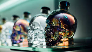 Crystal Head Vodka Displayed Prominently On Bar Shelves Wallpaper