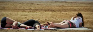 Curvy Woman Resting In A Park Wallpaper