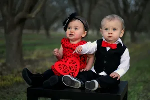 Cute Baby Couple Formal Black & Red Attire Wallpaper