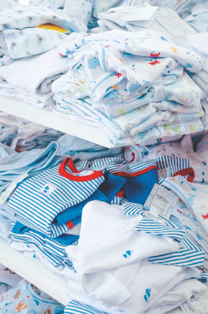 Cute Blue Baby Clothes Wallpaper