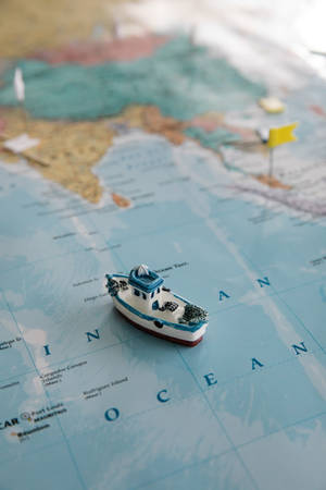 Cute Blue Boat On Map Wallpaper