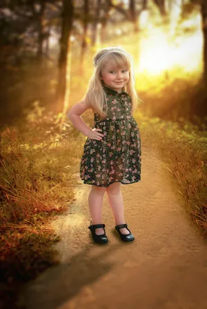 Cute Girl In Black Floral Dress Wallpaper