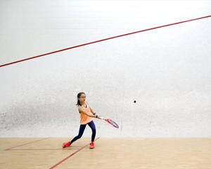 Cute Little Girl Playing Squash Wallpaper