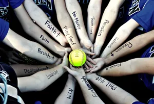 Cute Softball In Players Hands Wallpaper