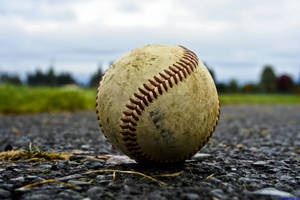 Cute Softball With Dirt Wallpaper