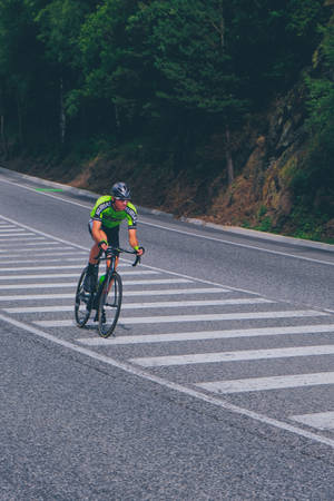 Cycling Man On Country Road Wallpaper