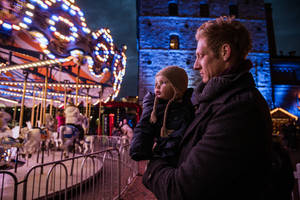 Dad And Daughter Watching Carousel Wallpaper