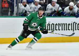 Dallas Stars' Premier Defenceman Miro Heiskanen In Action Wallpaper