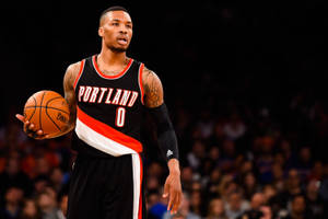 Damian Lillard Holding A Ball Wallpaper