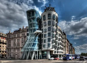 Dancing House Underneath Stormy Clouds Wallpaper