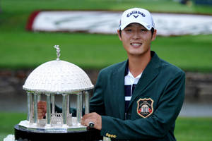 Danny Lee Holding His Award Wallpaper