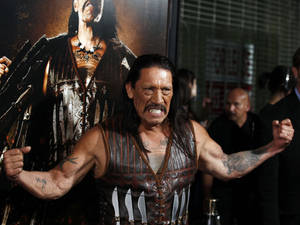 Danny Trejo Powerfully Flexing Muscles In Machete Film Event Wallpaper