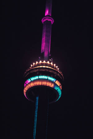 Dark Purple-toned Display Of Cn Tower On Iphone Wallpaper