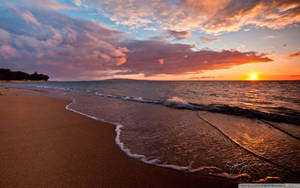 Dark Sand Beach On Sunset Wallpaper