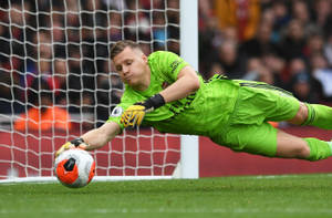 Dean Henderson Lunging For Ball Wallpaper