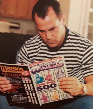Dean Malenko Reading Wrestling Magazine Wallpaper