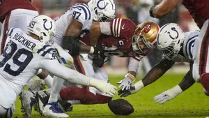 Deforest Buckner Fighting Over Football Wallpaper