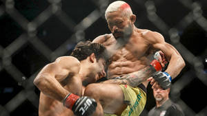 Deiveson Figueiredo In Intense Fight Wallpaper