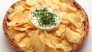 Delectable Chips And Dip In A Woven Basket Wallpaper