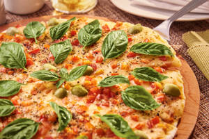 Delectable Margherita Neapolitan Pizza On Wooden Table Wallpaper