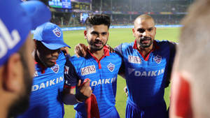 Delhi Capitals Red And Blue Jersey Wallpaper