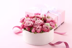 Delicate Light Pink Flowers Arranged In A Box Wallpaper