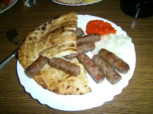Delicious Grilled Ćevapi With Pita Bread Wallpaper