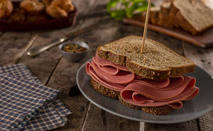 Delicious Ham Sandwich On Brown Bread Wallpaper