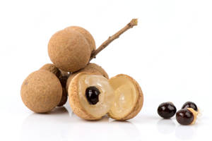 Delicious Longan Fruits And Seeds On Display Wallpaper