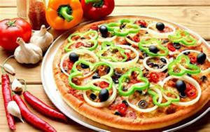 Delicious Pizza Topped With Green Pepper Thin Slices Wallpaper