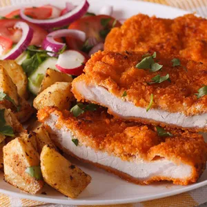 Delicious Traditional Wiener Schnitzel Served On Plate Wallpaper