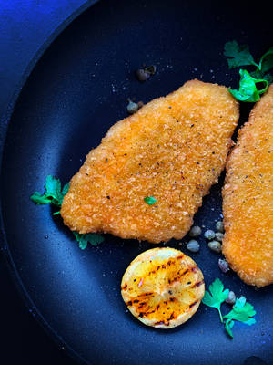 Delicious Wiener Schnitzel With Herbs Wallpaper