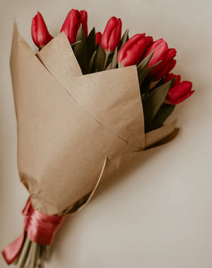 Delightful Bouquet Of Fresh Red Tulips Wallpaper