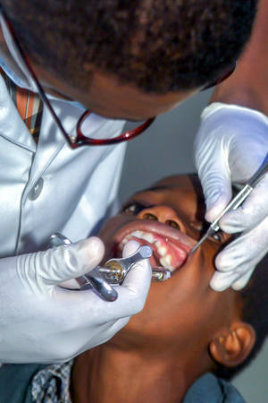 Dentistry Syringe Used On Patient Wallpaper