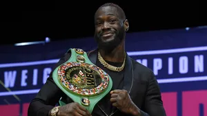 Deontay Wilder With W B C Championship Belt Wallpaper