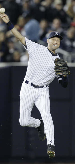 Derek Jeter Happily Playing With The Ball Wallpaper