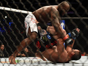 Derrick Lewis Beating Down Opponent Wallpaper