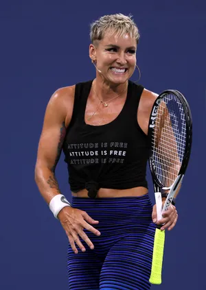 Determined Bethanie Mattek-sands With Her Signature Short Hair On Court Wallpaper