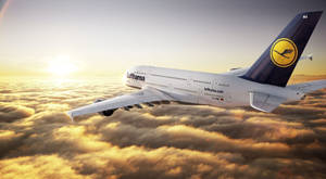 Deutsche Lufthansa Airplane On Golden Sky Wallpaper