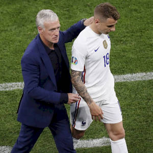 Didier Deschamps Walking With Lucas Digne Wallpaper