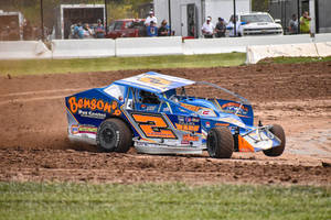 Dirt Car Racing On Dirt Track Wallpaper