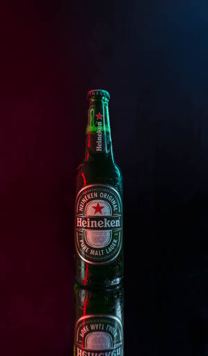 Distinctive Heineken Beer Bottle Against A Cinematic Backdrop Wallpaper